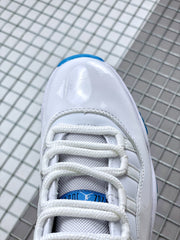 Close-up of the white laces, tongue, and glossy white toe area.