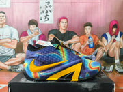 Side view of a multicolor Nike basketball shoe with a yellow Swoosh and angular yellow accents
