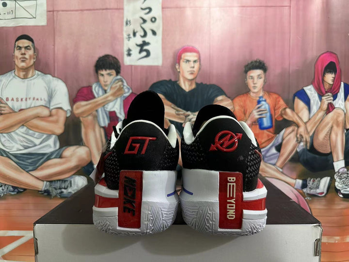 Rear view of black basketball shoes with red and white heel details
