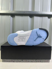 Outsole view showing translucent blue sections, black traction accents, and Nike branding.