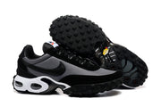 Black and grey sneakers shown from the side and underside, highlighting the lugged outsole.