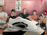 Side view of a white and black Jordan Luka basketball shoe with patterned side detailing and a personalized heel graphic.