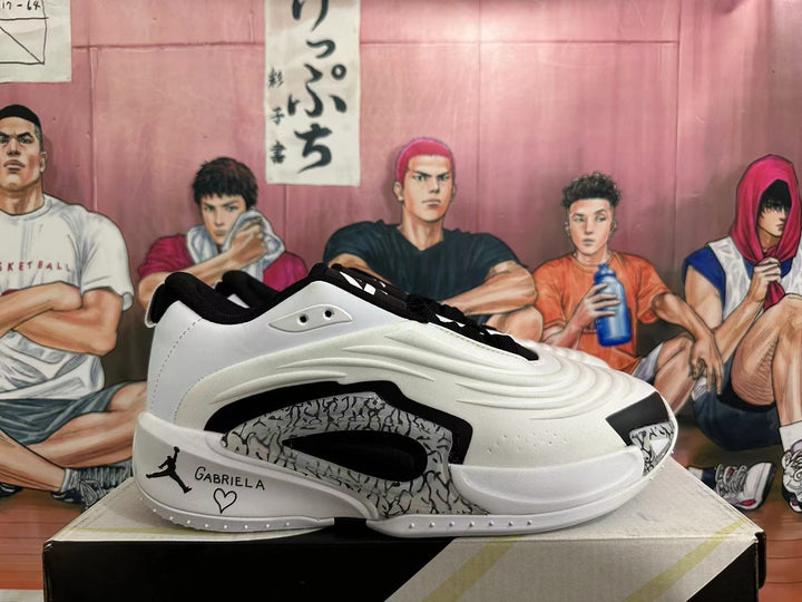Side view of a white and black Jordan Luka basketball shoe with patterned side detailing and a personalized heel graphic.