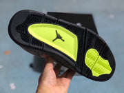 Underside view showing a black outsole with bright green traction sections and a Jordan logo.