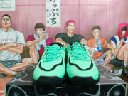 Front view showing the green uppers, black trim, and lace-up construction of the Jordan sneakers.