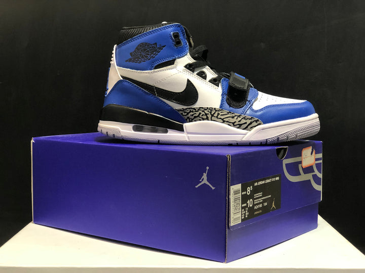 White and blue high-top sneaker displayed on a Jordan shoebox, with the box label visible.