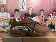 Side profile of a brown sneaker with metallic silver detailing and a chunky outsole