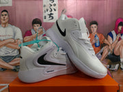 Angled view of paired white Nike basketball sneakers showing black Swoosh branding, padded collars and patterned outsoles.