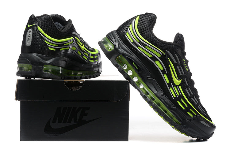 Black Nike Air Max sneakers with volt accents displayed on a black shoebox