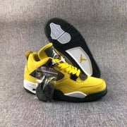 Pair of yellow and black high-top sneakers displayed with an extra lace bundle and a visible outsole.