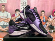 Pair of black and purple Nike basketball sneakers shown from side and three-quarter angles.