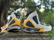 Rear and side views of navy, white, and yellow Nike Kobe 2K5 high-tops