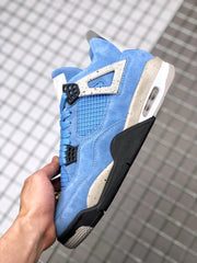 Side view highlighting the blue upper, speckled support panel, black lower section, and visible midsole window.