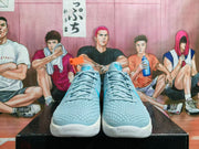 Front view of the light blue lace-up basketball shoes