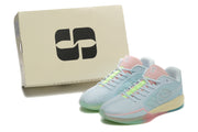 Pair of pastel blue basketball shoes beside a box labeled Sabrina Ionescu.