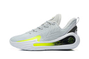 Side view of light grey Nike LeBron basketball shoes with white soles and bright volt accents.