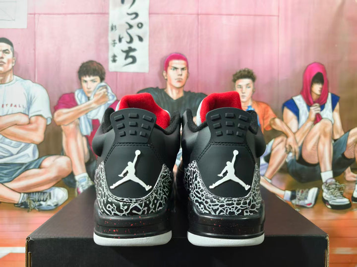 Rear view of black and white Jordan 3-style sneakers with elephant-print overlays, red collar lining, and Jumpman heel logos.