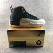 Side profile of the black and light-colored high-top sneaker displayed on a Jordan shoebox.