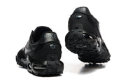 Rear and outsole views of black Nike Air Max Waffle SP sneakers.