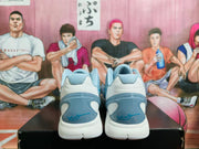 Rear view of light blue and white Nike Zoom basketball shoes