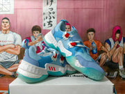 Pair of blue and white basketball shoes shown from the side, with red accents and aqua outsoles