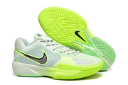 Light green and yellow Nike G.T Cut Cross EP basketball sneakers with contrasting black swoosh details and a patterned outsole.