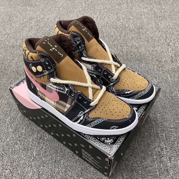 Pair of black, brown, and pink mid-top sneakers with paisley-inspired panels, cream laces, and a shoebox.