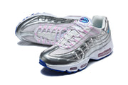 Pair of silver Nike Air Max 95 sneakers with pink and blue accents