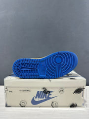 Blue rubber outsole displayed from below, showing its circular traction pattern.