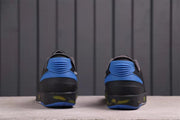Rear view of the sneakers showing blue heel components and translucent outsole accents.
