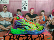 Side view highlighting the layered graphic upper, contrasting laces, sculpted midsole, and colorful outsole.