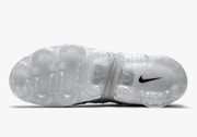 Underside view showing the transparent segmented sole of the Nike Air VaporMax Plus sneaker
