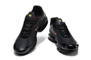 Front and top views of black Nike Air Max Plus VII sneakers with orange Swoosh accents