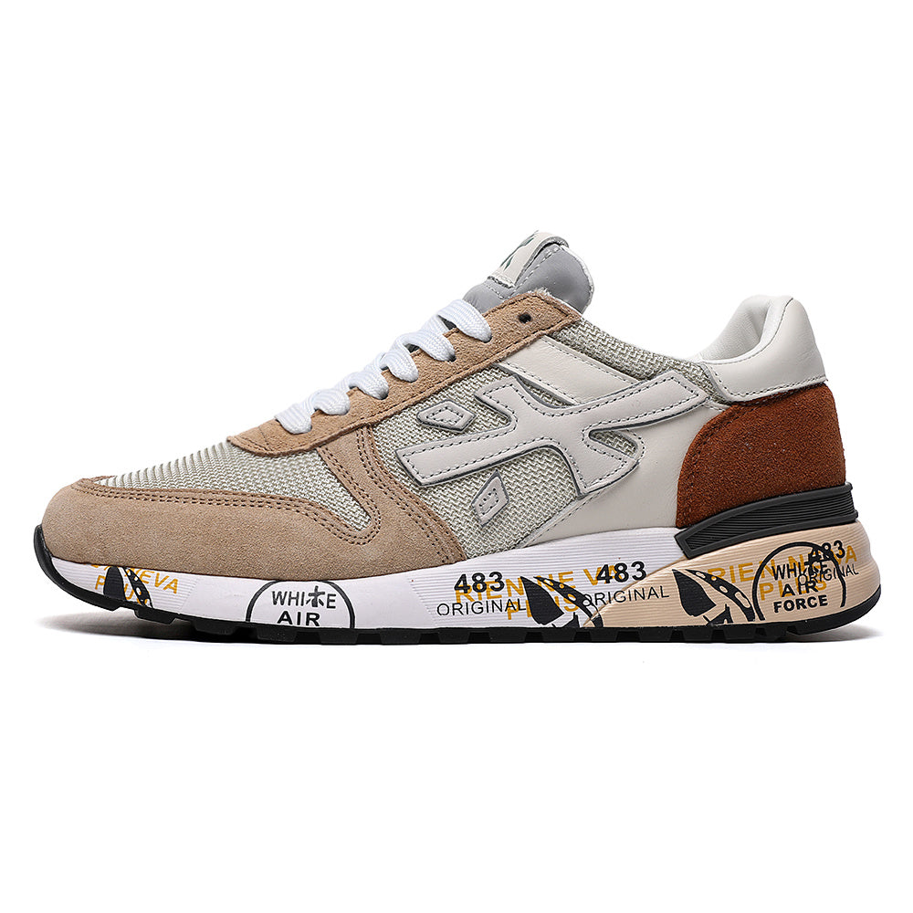 Beige and brown low-top sneaker with layered panels, white laces, an N-shaped side design, and printed midsole graphics