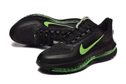Pair of black Nike Pegasus Premium shoes with green Swoosh accents, viewed from above