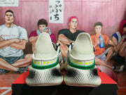 Rear view showing the SLIPSPEED heel marking, raised collars and patterned black-and-white outsoles.