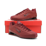 Burgundy Nike Shox Z R2 sneakers displayed on a red shoe box