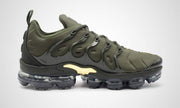 Side profile showing the olive upper, dark overlays, and segmented sole.