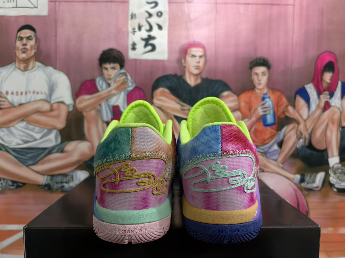 Rear view of multicolor Nike basketball sneakers with pink heels, lime collars, contrasting outsoles, and a basketball-themed illustrated backdrop.