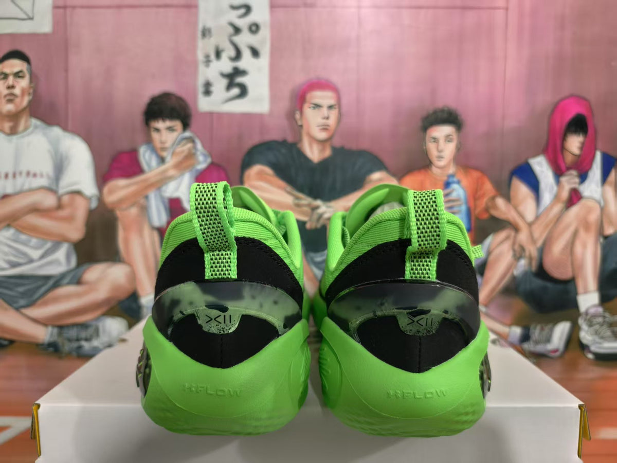 Rear view of bright green sneakers showing black heel panels, green pull tabs and a sculpted outsole.