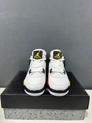 Front view of the pair showing white laces, mesh tongues, black tongue labels, and yellow side accents.