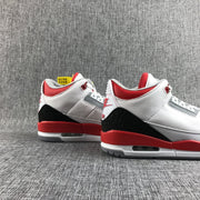 Pair of white, red, and black high-top sneakers displayed together.