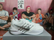 Side profile of a white Nike basketball sneaker with a silver Swoosh, layered upper panels, and textured outsole.