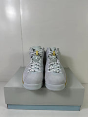 Front view of the white high-top sneakers with decorative pearl-like lace details and gold lace hardware.