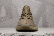 Front view showing the rounded toe, lace-up design and textured woven upper.