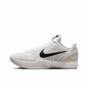 White Kobe 6 sneaker with a black Swoosh, star-patterned textured upper, and white outsole.