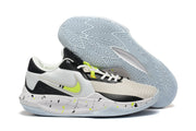 Black, white, and gray basketball shoe with a neon accent and patterned outsole.