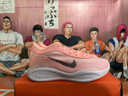 Side profile of a pink basketball shoe with black Nike Swoosh and white midsole