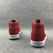 Rear view of both red high-top sneakers showing padded collars and heel details.
