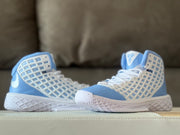 Pair of Nike Kobe 3 shoes displayed from the side, highlighting the high-top shape and white patterned midsoles.